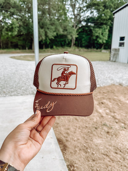 Howdy Ropin’ Cowboy Trucker Hat in Brown